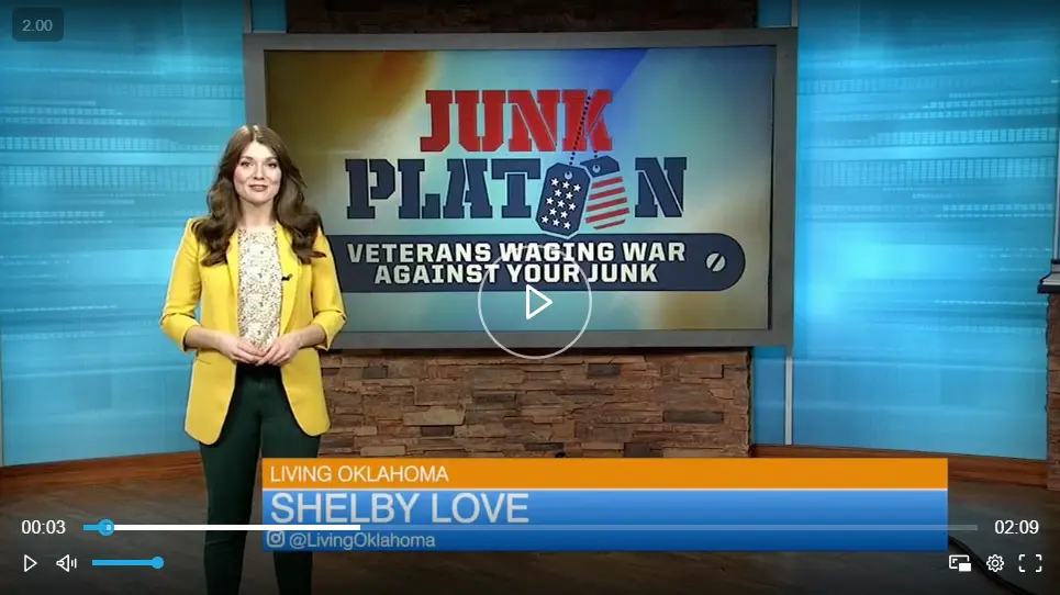 Video still: host Shelby Love on the Living Oklahoma set beside a screen showing the Junk Platoon logo and the line Veterans Waging War Against Your Junk