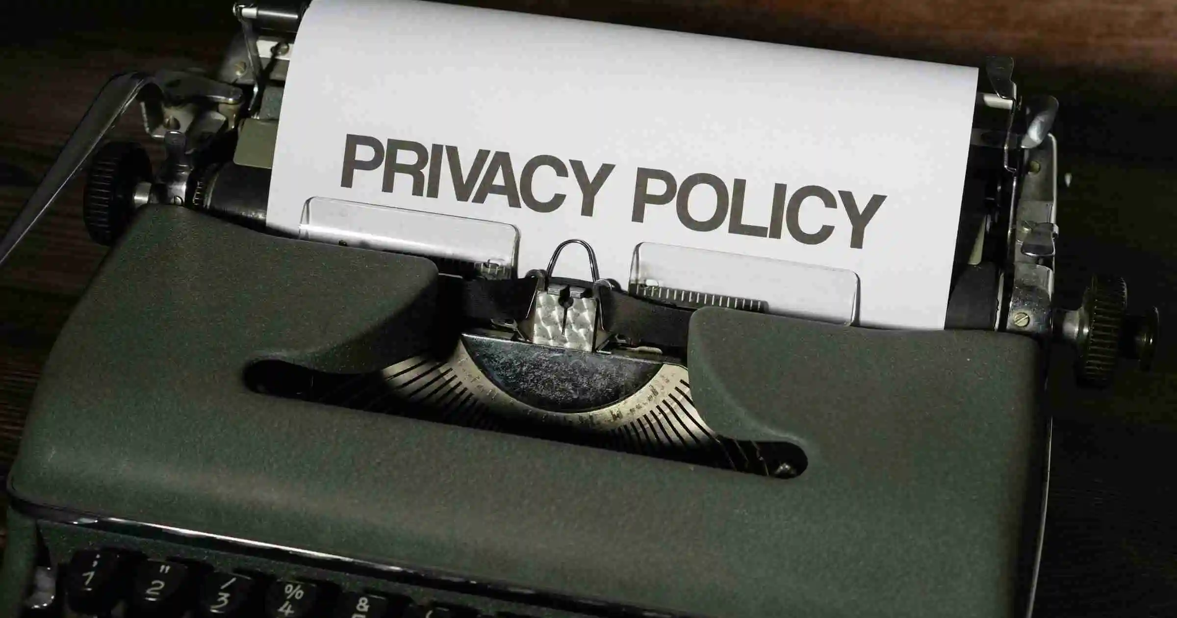 Notebook and pen on a desk representing privacy and responsibility